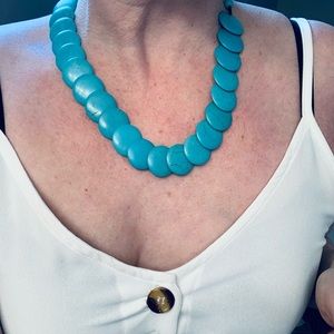 Turquoise necklace with twist clasp.
